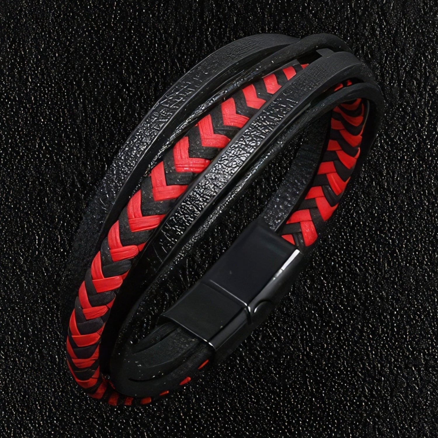 Black leather multi stranded bracelet with red arrows.